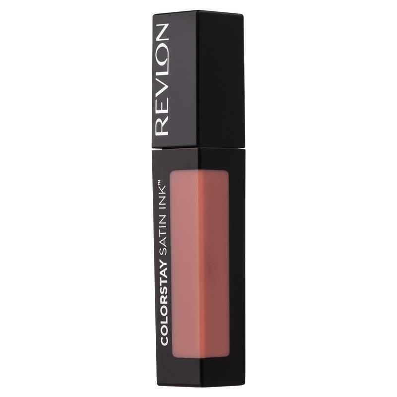 A tube of Revlon Color Stay Satin Ink Lip Color in a pink shade, with the brand name and product line visible on the packaging.