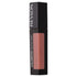 A tube of Revlon Color Stay Satin Ink Lip Color in a pink shade, with the brand name and product line visible on the packaging.