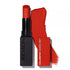 A Revlon Colorstay Suede Ink Lipstick in a red shade with its cap on, showcasing the product's texture.